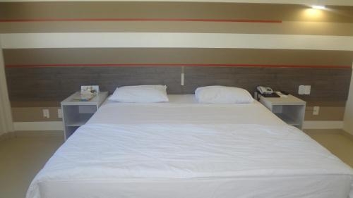 Imagen de la habitación del Hotel Esuites Vale Dos Carajás. Foto 8