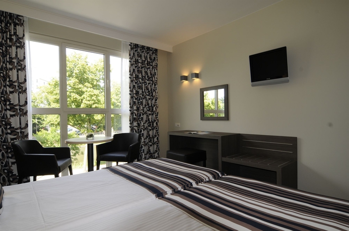 Imagen de la habitación del Hotel Europahotel Gent. Foto 10
