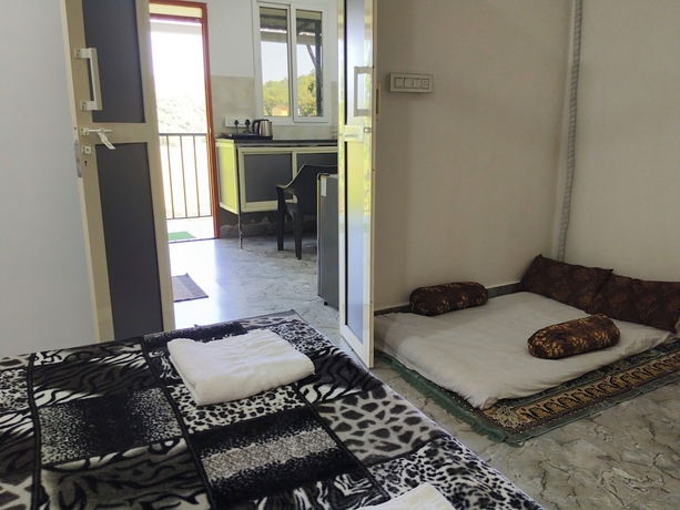 Imagen de la habitación del Hotel Eva Rooms 50 mtr From Ashwem Beach. Foto 9