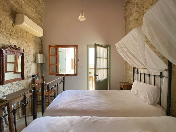 Imagen de la habitación del Hotel Eveleos Country House. Foto 17