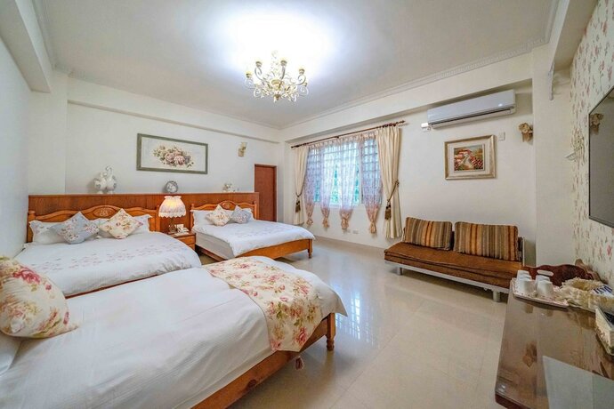 Imagen de la habitación del Hotel Evergreen Garden House. Foto 14