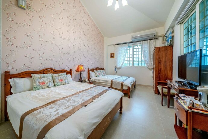 Imagen de la habitación del Hotel Evergreen Garden House. Foto 18