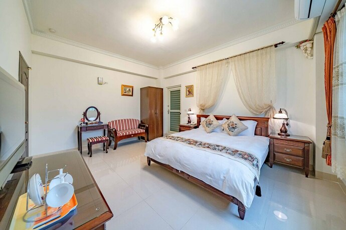 Imagen de la habitación del Hotel Evergreen Garden House. Foto 24