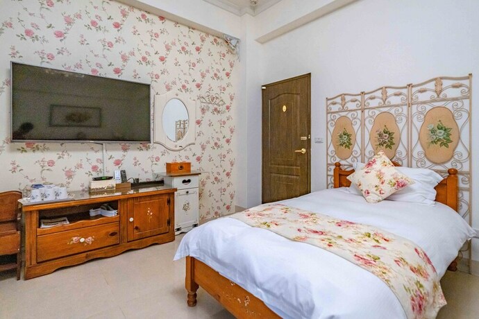 Imagen de la habitación del Hotel Evergreen Garden House. Foto 35