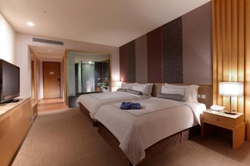 Imagen de la habitación del Hotel Evergreen Resort - Jiaosi. Foto 8