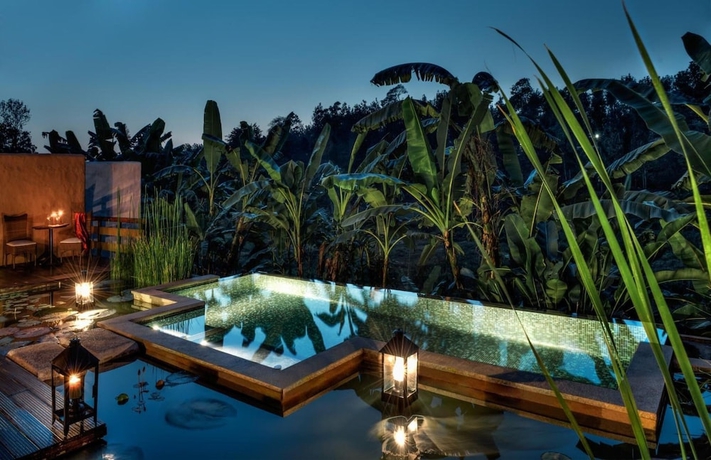 Imagen de la piscina del Hotel Evolve Back, Coorg. Foto 18