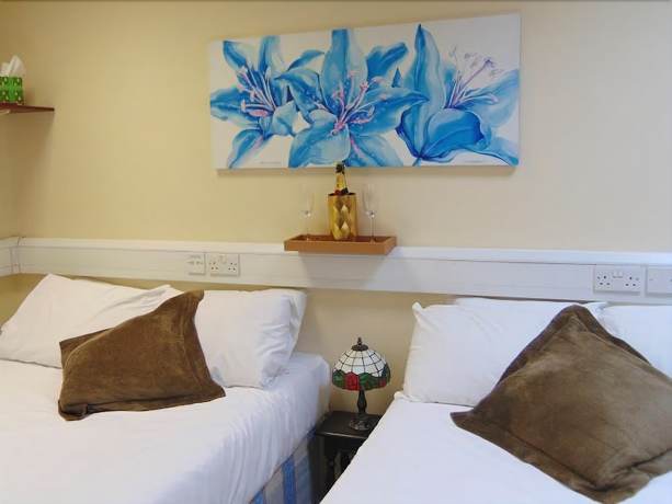 Imagen de la habitación del Hotel Excel Guest House. Foto 17