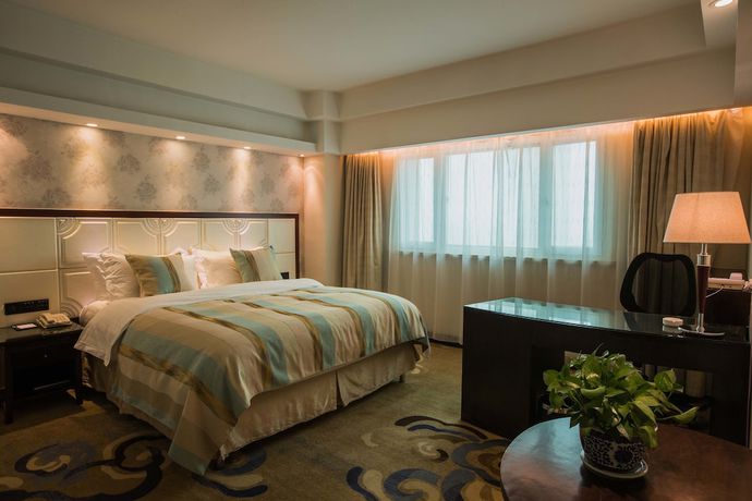 Imagen de la habitación del Hotel Excemon Xinjiang Yilite. Foto 10