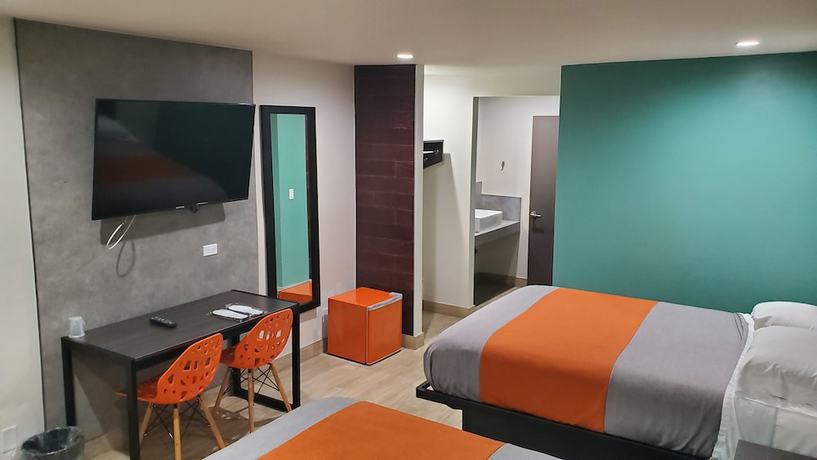 Imagen de la habitación del Hotel Exclusivo Inn and Suites. Foto 5