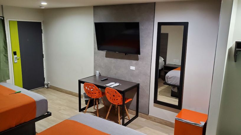Imagen de la habitación del Hotel Exclusivo Inn and Suites. Foto 7