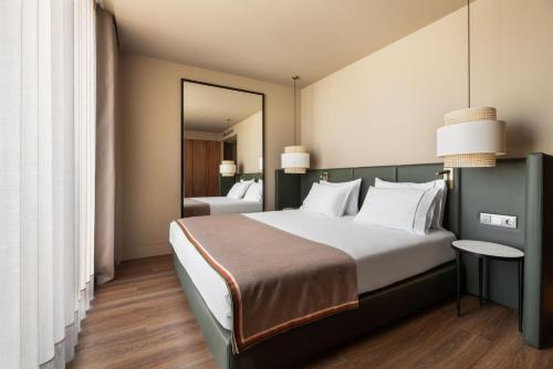 Imagen de la habitación del Hotel Exe Essenzia Porto. Foto 6