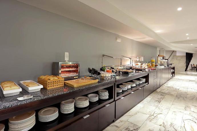 Imagen del bar/restaurante del Hotel Exe Isla Cartuja. Foto 3