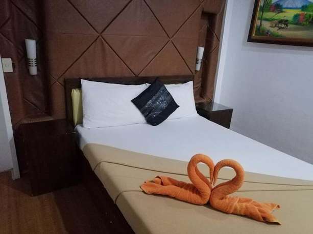 Imagen de la habitación del Hotel Ey Miners Suites Navarro. Foto 12