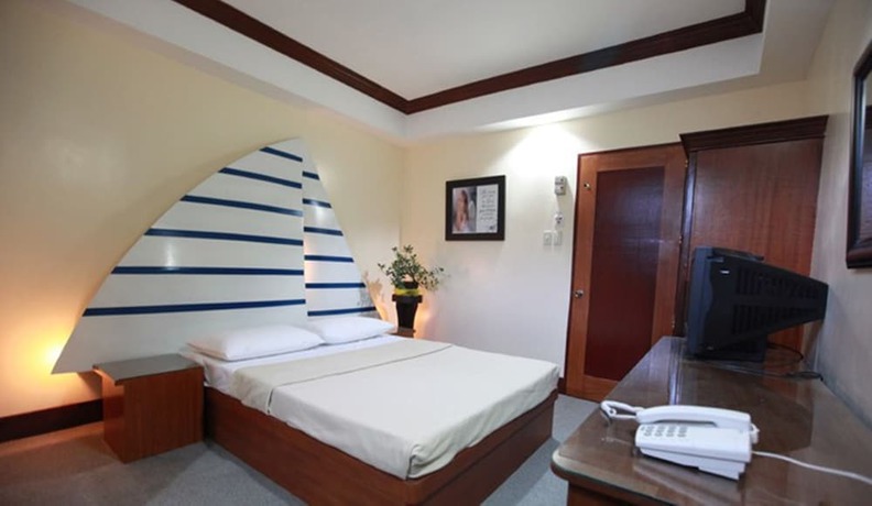 Imagen de la habitación del Hotel Ey Miners Suites Navarro. Foto 13