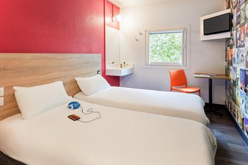 Imagen de la habitación del Hotel F1 Les Ulis Courtaboeuf. Foto 16