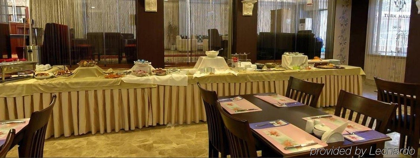 Imagen del bar/restaurante del Hotel FLORYA KONAGI. Foto 9