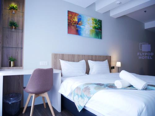 Imagen de la habitación del Hotel FLYPOD HOTEL. Foto 6