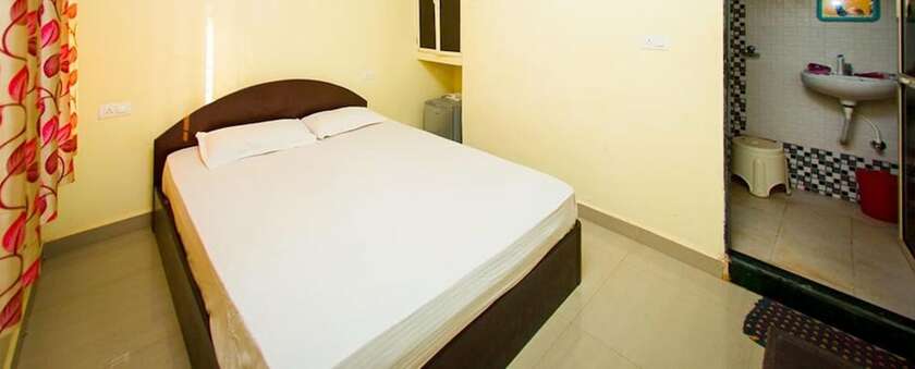 Imagen de la habitación del Hotel FabExpress Morjim Highland With Swimming Pool. Foto 19