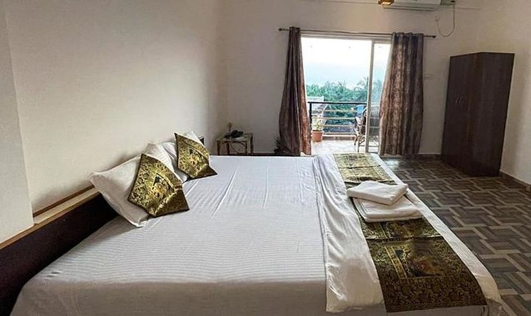 Imagen general del Hotel FabExpress The Voyage, Morjim. Foto 3
