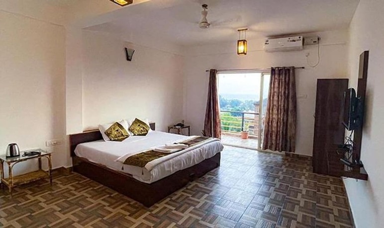 Imagen general del Hotel FabExpress The Voyage, Morjim. Foto 4