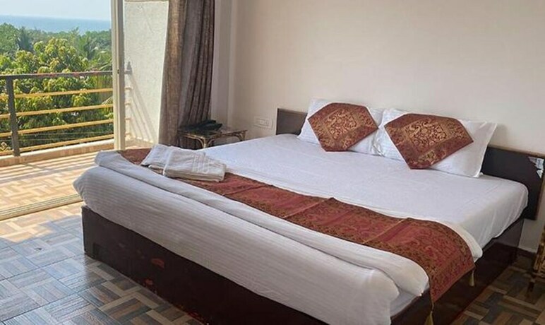 Imagen general del Hotel FabExpress The Voyage, Morjim. Foto 18