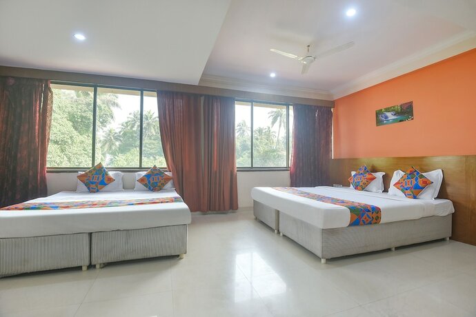 Imagen de la habitación del Hotel Fabexpress Amrut Comforts Suites. Foto 18