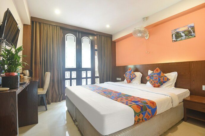 Imagen de la habitación del Hotel Fabexpress Amrut Comforts Suites. Foto 19