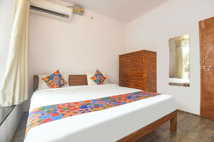 Imagen de la habitación del Hotel Fabexpress Holiday Suites. Foto 17