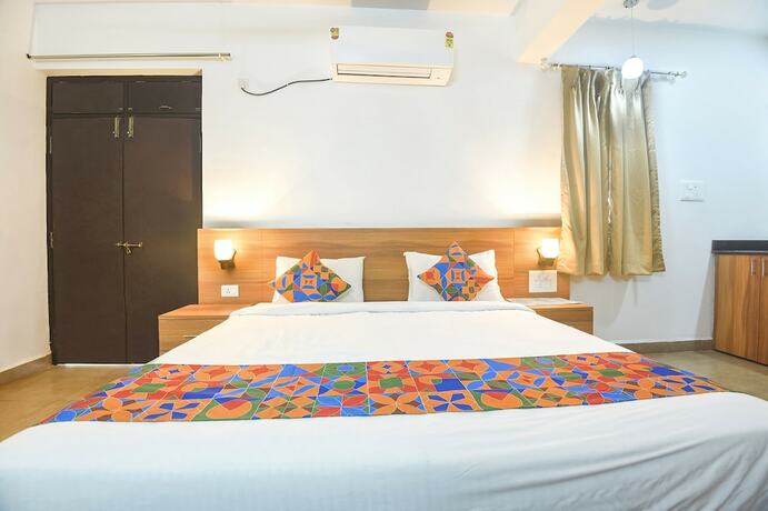 Imagen de la habitación del Hotel Fabexpress Holiday Suites. Foto 20