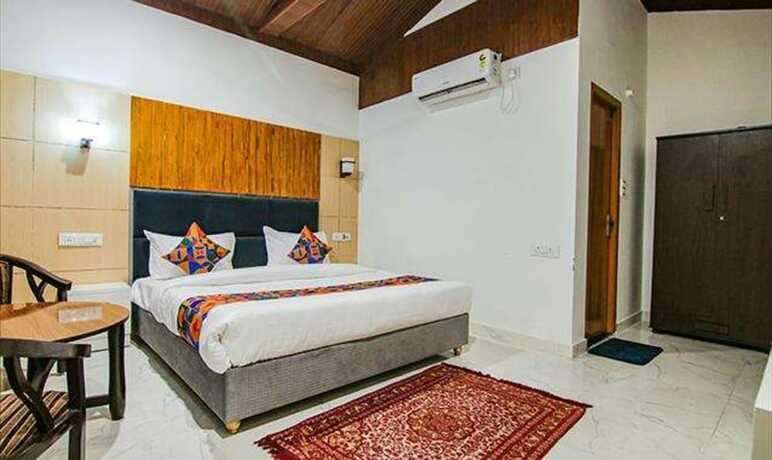 Imagen de la habitación del Hotel Fabhotel Corbett Tiger Resort. Foto 19