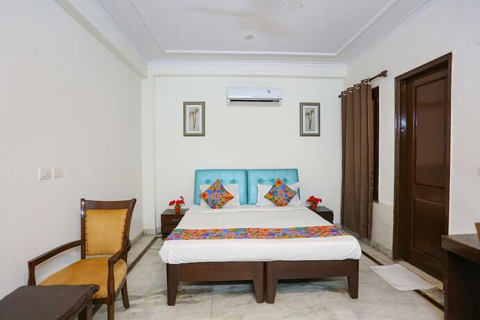 Imagen de la habitación del Hotel Fabhotel Grand Palace. Foto 19