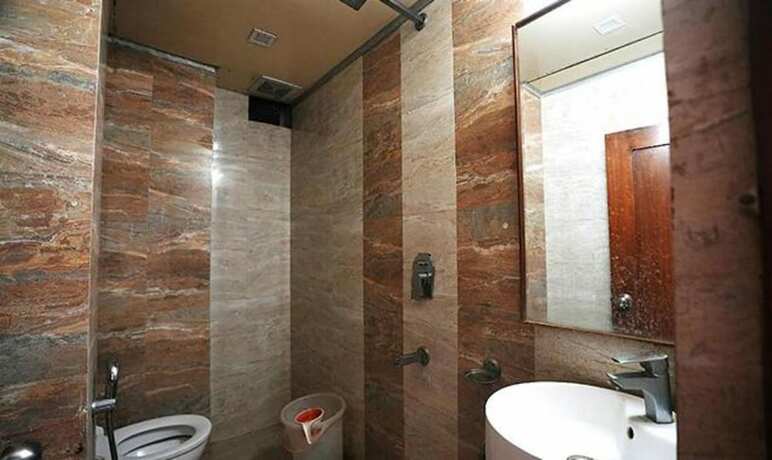 Imagen de la habitación del Hotel Fabhotel Madurai. Foto 19