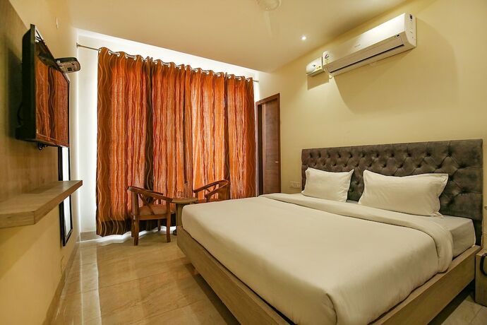 Imagen de la habitación del Hotel Fabhotel Melano. Foto 18
