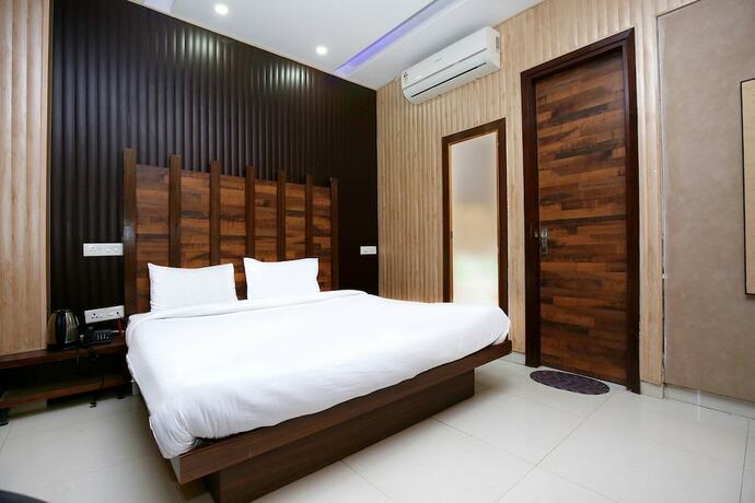 Imagen de la habitación del Hotel Fabhotel Pearl Grand. Foto 18