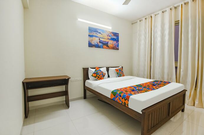 Imagen de la habitación del Hotel Fabhotel Prime Santoshi Holiday Homes. Foto 19