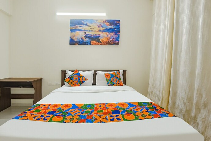 Imagen de la habitación del Hotel Fabhotel Prime Santoshi Holiday Homes. Foto 20