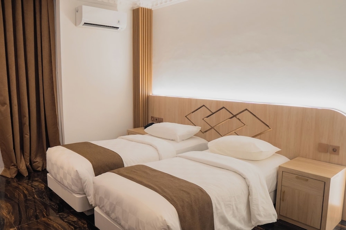 Imagen de la habitación del Hotel Fahira Syariah Padang. Foto 2