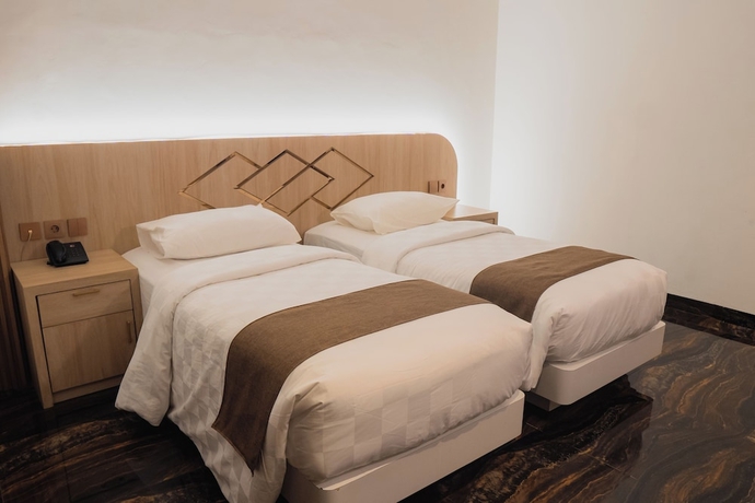 Imagen de la habitación del Hotel Fahira Syariah Padang. Foto 11