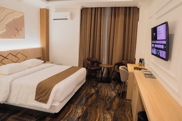 Imagen de la habitación del Hotel Fahira Syariah Padang. Foto 14
