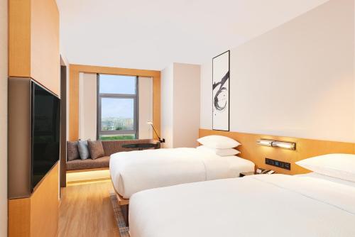 Imagen de la habitación del Hotel Fairfield by Marriott Guangzhou Konggang. Foto 11