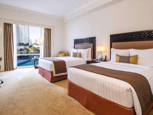 Imagen de la habitación del Hotel Fairmont Makati. Foto 17