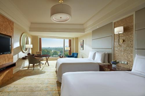 Imagen de la habitación del Hotel Fairmont Yangcheng Lake. Foto 7