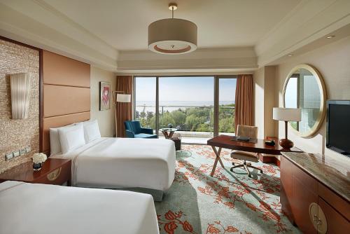 Imagen de la habitación del Hotel Fairmont Yangcheng Lake. Foto 13