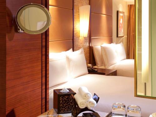 Imagen de la habitación del Hotel Fairmont Yangcheng Lake. Foto 14