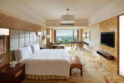 Imagen de la habitación del Hotel Fairmont Yangcheng Lake. Foto 16