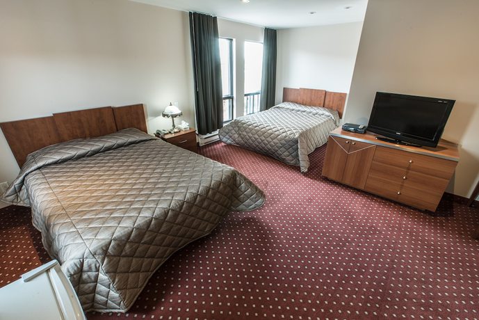 Imagen de la habitación del Hotel Falcon Motel Brossard. Foto 9