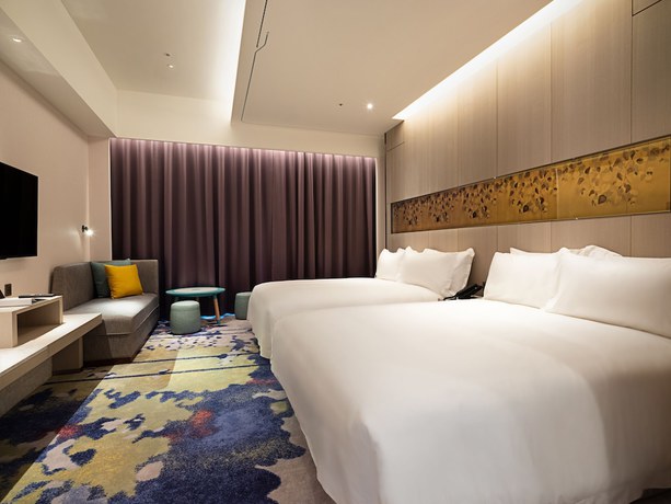 Imagen de la habitación del Hotel Fame Hall Garden Hotel. Foto 18