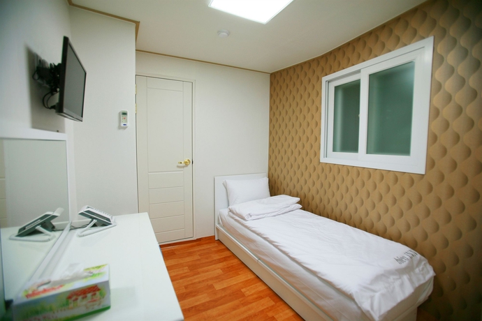 Imagen de la habitación del Hotel Familia INN. Foto 9
