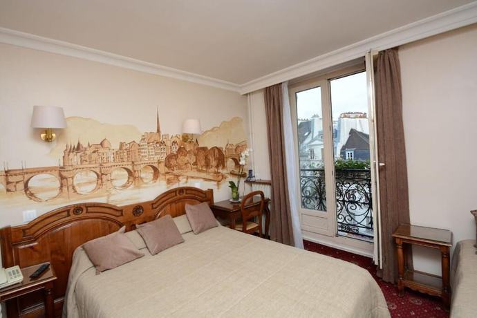 Imagen de la habitación del Hotel Familia, París. Foto 8