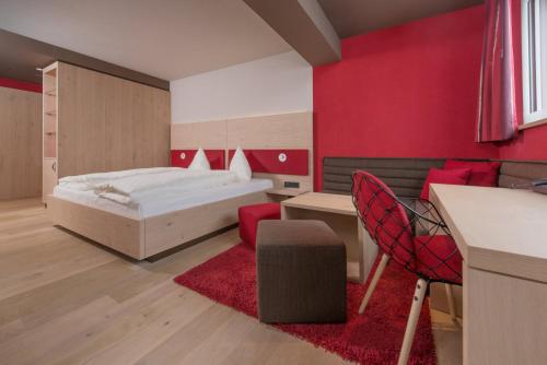 Imagen de la habitación del Hotel Familotel Alphotel. Foto 17